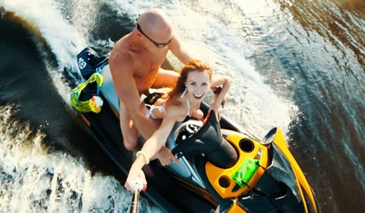 Petite teen rides hard in public on a jet ski