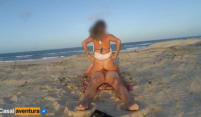 Blonde Brazilian MILF enjoys public anal on the beach as people watch nearby